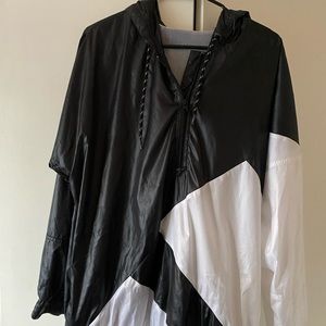 Nike black and white quarter zip rain jacket.